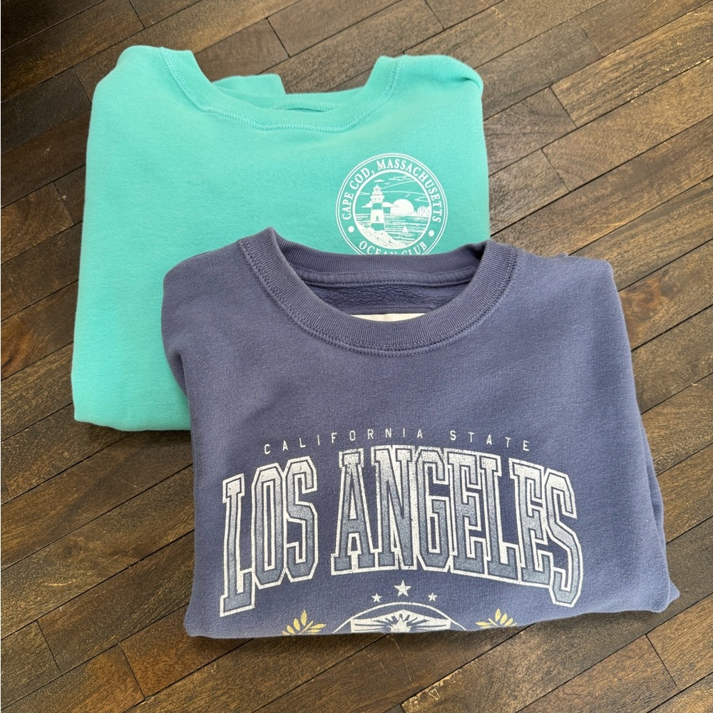 Two Abercrombie Kids graphic sweatshirts.